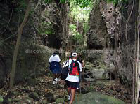 Hiking up Bloody Point River in Challengers St. Kitts.  Ancient rock drawings adorn portions of the walls of the ravine. The river was also the site of a fierce battle between the Caribs and the British.