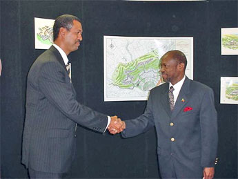 St. Kitts and Nevis Prime Minister and Minister of Tourism, Dr. the Hon. Denzil L. Douglas (r) and Managing Director of Belmont Resorts Limited Mr. Valmiki Kempadoo shaking hads after signing the Agreement. 