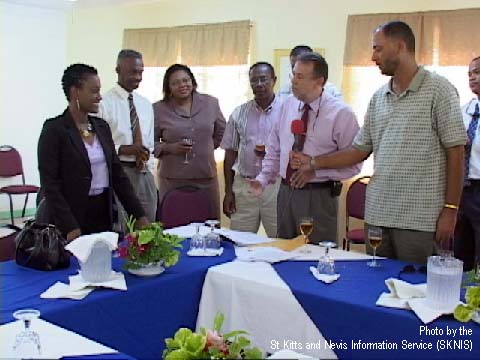 World Cup Bid Committee Chairman Charles Wilkin addressing Minister of Sports Hon. Jacinth Henry-Martin while other Bid Committee members look on. Former West Indies Cricket Team Manager Ricky Skerritt is holding the microphone.