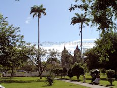 St Kitts heritage sites photos - Locals relaxing on a bench in Independence Square in downtown Basseterre St Kitts