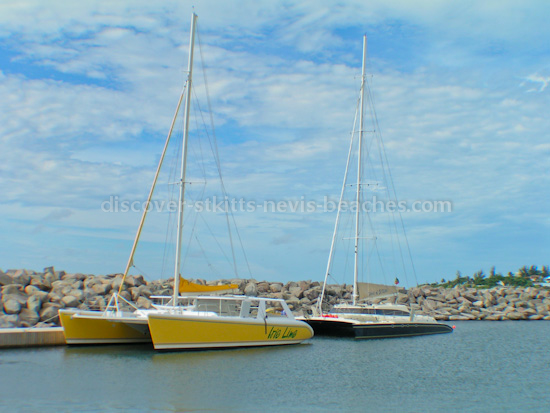 Photo of Irie Lime and Spirit of St. Kitts Catamarans docked at Port Zante Marina in St. Kitts.