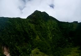 St Kitts tours and Island Safaris with Captain Sunshine Tours. St Kitts photo of Captain Sunshine Tours St Kitts volcano hike showing the crater and summit at Mt. Liamuiga