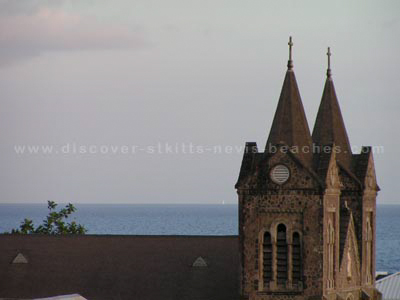 The Catholic Church viewed from the Southern Stands at the new Warner Park Cricket Stadium in St. Kitts