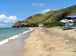 Photo of the beach at South Friars Bay in St. Kitts with the dolphin enclosure under construction in background